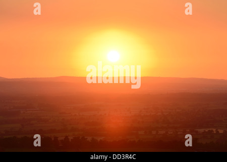 Sunset over the Cheshire Plain looking north west towards Wales UK Stock Photo