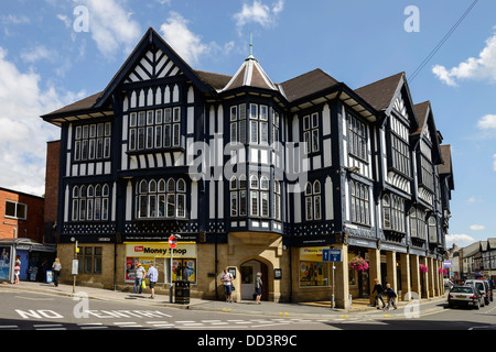 Black and white timber framed building and The Money Shop in Chesterfield town centre UK Stock Photo