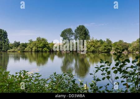 A view from a birdwatching hide at the Langford Lakes part of the Wiltshire Wildlife Trust at Steeple Langford , Wiltshire , Uk Stock Photo