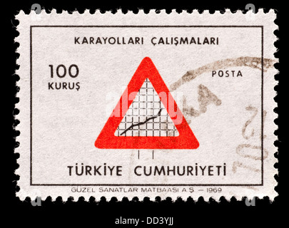 Postage stamp from Turkey depicting a highway construction sign. Stock Photo