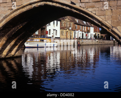 A view of the quay from under the arch of St Ives Bridge. Huntingdonshire. Cambridgeshire Stock Photo