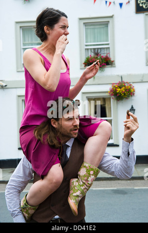 street performers eco dancers on the streets of Brecon during Brecon Jazz Festival 2013 Stock Photo