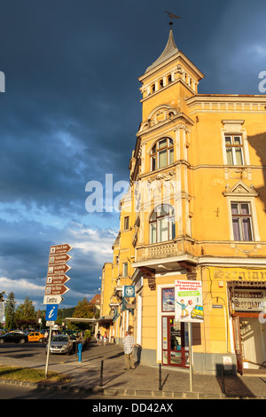 Old historic building lit by the sunset light on overcast day on July 16, 2012 in Brasov, Romania. Stock Photo