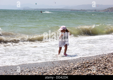 A young girl playing in the surf Stock Photo