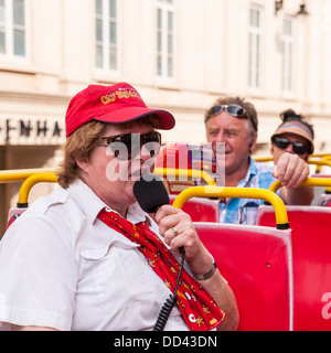 A guide speaking on a City Sightseeing Tour bus in Bath , Somerset , England , Britain , Uk Stock Photo