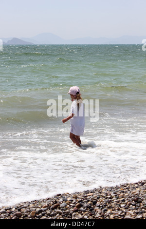 A young girl playing in the surf Stock Photo