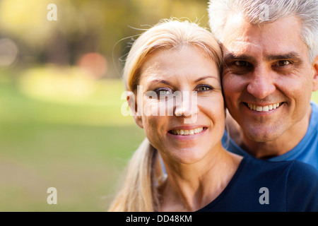 elegant middle aged couple closeup portrait outdoors Stock Photo