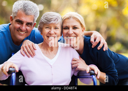 portrait of mid age couple and senior mother outdoors Stock Photo
