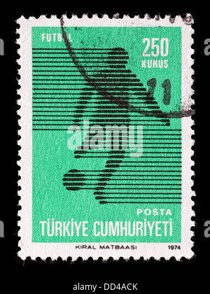 Postage stamp from Turkey depicting a stylized soccer player. Stock Photo