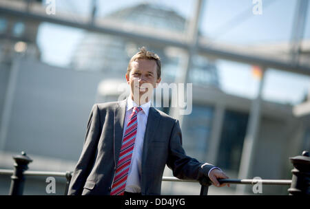 Bernd Lucke, top candidate of the German party 'Alternative fuer Deutschland' ('Alternative for Germany', AfD), poses in front of the Reichstag building in Berlin, Germany, 26 August 2013. Germany will hold general election on 22 September. Photo: KAY NIETFELD Stock Photo