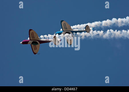 Little Gransden, Cambs, UK. 25th August 2013. The SWIP aerobatic team of Peter Wells and Guy Westgate  display  over the LITTLE GRANSDEN Airshow Credit:  Motofoto/Alamy Live News Stock Photo