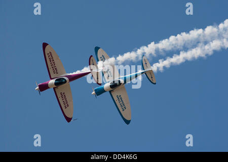 Little Gransden, Cambs, UK. 25th August 2013. The SWIP aerobatic team of Peter Wells and Guy Westgate  display  over the LITTLE GRANSDEN Airshow Credit:  Motofoto/Alamy Live News Stock Photo