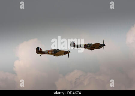 Little Gransden, Cambs, UK. 25th August 2013. The Battle of britain flight (Hurricane and Spitfire) display  over the LITTLE GRANSDEN Airshow Credit:  Motofoto/Alamy Live News Stock Photo