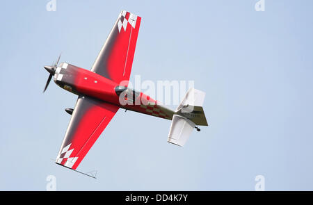 Little Gransden, Cambs, UK. 25th August 2013. Mark Jefferies puts his EXTRA 330SC through his aerobatic display  over the LITTLE GRANSDEN Airshow Credit:  Motofoto/Alamy Live News Stock Photo