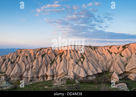 Typical landscape with sandstone formations in Cappadocia, Turkey, at sunset Stock Photo