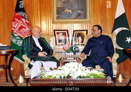 Islamabad, Pakistan. 26th Aug, 2013. President asif ali zardari with afgan president hamid karzai on latters arrival at the aiwan-e-sadr on august 26 august 2013     Handout by Pakistan informtion departmentCredit: PID/Deanpictures/Alamy Live News Stock Photo