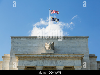 Flags flying on the Federal Reserve building, Washington DC, USA Stock Photo