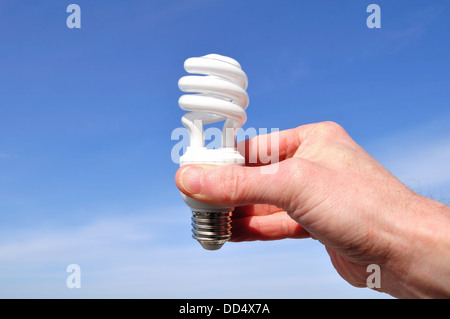 Hand holding a low energy light bulb Stock Photo