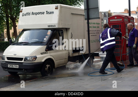 Islington council Graffiti Response Team cleaning pavement, London Stock Photo