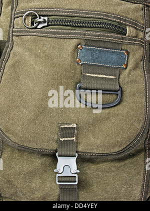 buckle on the old green backpack Stock Photo