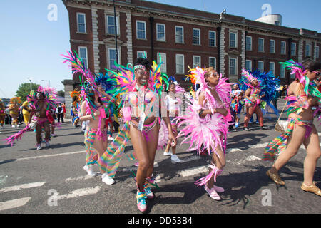 Notting Hill, London, UK. 26th Aug, 2013. Dancers in costumes take part in the annual carnival as thousands of revellers  attend the Notting Hill carnival  on day two with giants floats and parades though West London. The 49th Notting HIll carnival is Europe's biggest street festival which celebrates caribbean food, culture and music Credit:  amer ghazzal/Alamy Live News Stock Photo