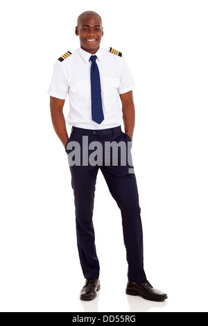 cheerful young African airline pilot standing over white background