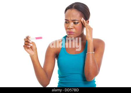 confused African woman looking at pregnancy test isolated on white Stock Photo