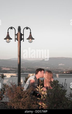 couple kissing on a rooftop in Italy Stock Photo
