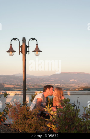 couple kissing on a rooftop in Umbria Stock Photo