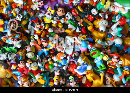 a large collection of colorful vintage Disney pvc toy figures, including Mickey Mouse, Minnie, Donald Duck, Goofy, Pluto Stock Photo