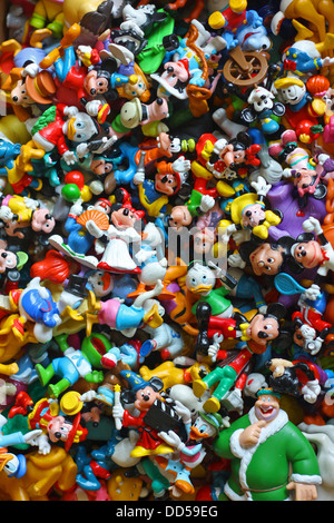 a large collection of colorful vintage Disney pvc toy figures, including Mickey Mouse, Minnie, Donald Duck, Goofy, Pluto Stock Photo