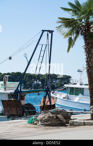 Bottom trawler with otterboards and nets at the Harbourside Porec in the Adriatic. Stock Photo