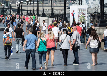 People walking along the South Bank in London. Stock Photo