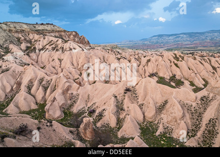 Typical landscape with sandstone formations in Cappadocia, Turkey, at sunset Stock Photo