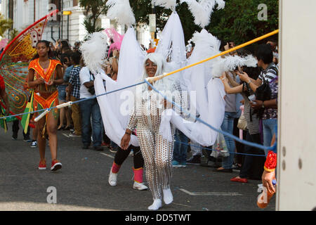 Notting Hill, UK. 26th Aug, 2013. Colourful costumes on show at the Notting Hill carnival. Credit: Keith Larby/Alamy Live News Stock Photo