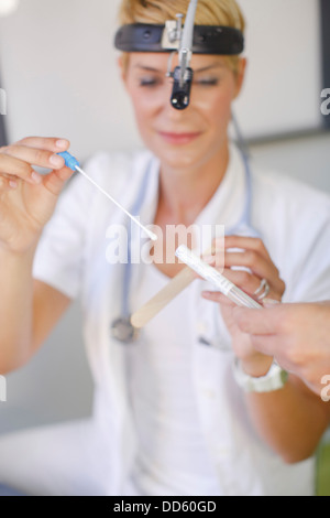 ENT physician With Throat-Set Stock Photo