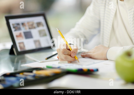 Boy using digital tablet and doing homework, Osijek, Croatia, Europe Stock Photo