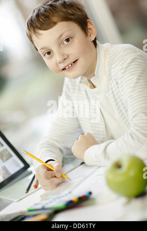 Boy using digital tablet and doing homework, Osijek, Croatia, Europe Stock Photo