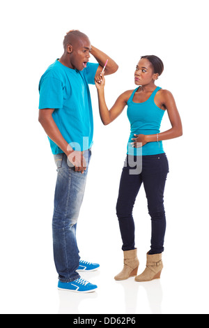 angry African woman showing her boyfriend pregnancy test isolated on white Stock Photo