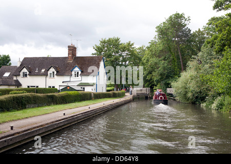 A narrowboat (barge) approaching the Theale swing bridge on the Kennet ...