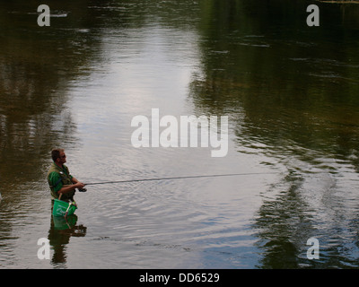 Man fishing in the River Avon, Fordingbridge, New Forest, Hampshire, UK 2013 Stock Photo
