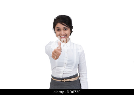 Female office worker signaling an agreement Stock Photo