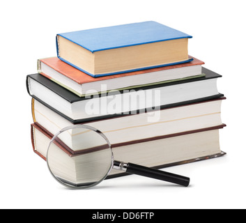 Magnifying glass and books stack isolated on white Stock Photo