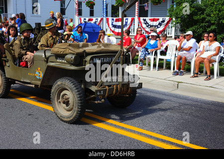 Soldier in military police jeep with Paris 97km sign on front, 4th of July Independence Day parades, Catonsville, Maryland, USA Stock Photo