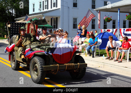 Soldiers in army jeep taking part in 4th of July Independence Day parades, Catonsville, Maryland, USA Stock Photo