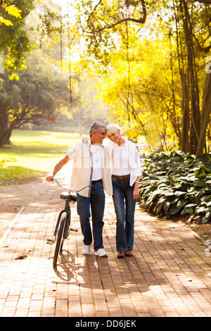 cute senior couple walking outdoors at the park Stock Photo