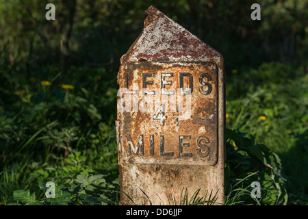 Milepost on towpath of Leeds and Liverpool canal in Rodley, Leeds showing the distance to Leeds City centre. Stock Photo
