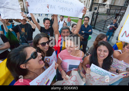 London, UK. 27th Aug, 2013. London, 27-08-2013. Slogans are chanted as Colombians in London demonstrate in solidarity with farmers in their home country striking against uncompetitive, monopolistic free trade agreements. Credit:  Paul Davey/Alamy Live News Stock Photo