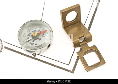 Antique compass and magnifying glass on map Stock Photo
