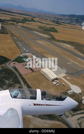 Aerial view of glider plane Twin Astir flying over aerodrome of Santa Cilia de Jaca, Aragon, Spain Stock Photo